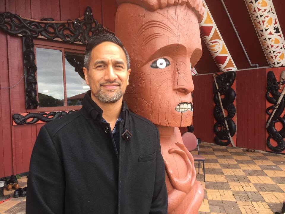 A guy in front of marae